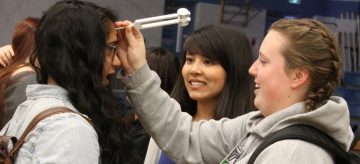 Stephanie Schindler (middle), first year UBC medical student leads hands-on activity for students at LV Rogers Secondary in Nelson as part of the Healthcare Travelling Roadshow.
