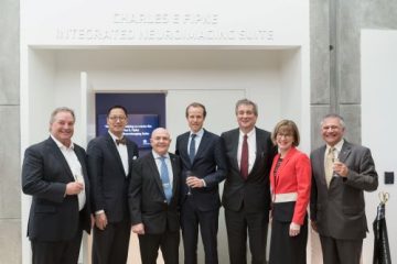 Pictured, left to right: Brad Bennett, Prof. Santa Ono, Charles Fipke, Dr. Haakon Nygaard, Dr. Dermot Kelleher, Heather McCaw, and Dr. Jon Stoessl. Image credit: Martin Dee/UBC.