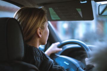 Woman driving a car and looking straight ahead