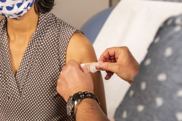 Woman receiving COVID-19 vaccine