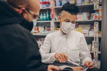 pharmacist helping client