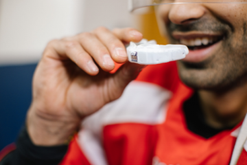 High-tech mouthguard tracks head impacts during varsity hockey playoffs