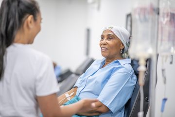 Senior adult woman in the oncology unit receiving chemotherapy treatment.