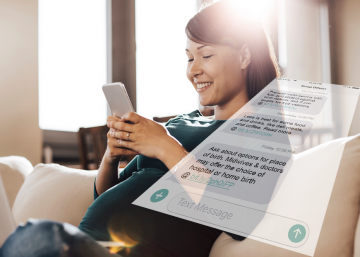 Pregnant woman uses the SmartMom text messaging service on her smartphone.