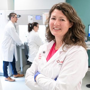 Dr. Tillie Hackett, right, with graduate students and technicians who form part of her Research Team.