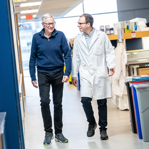 Brian MacVicar and Nick Weilinger walking in the lab