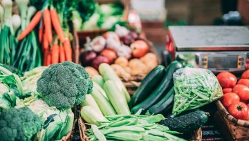 An assortment of vegetables on a countertop.